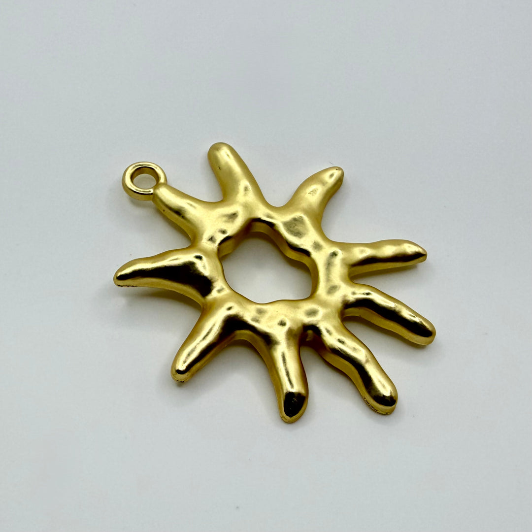Abstract sun charm