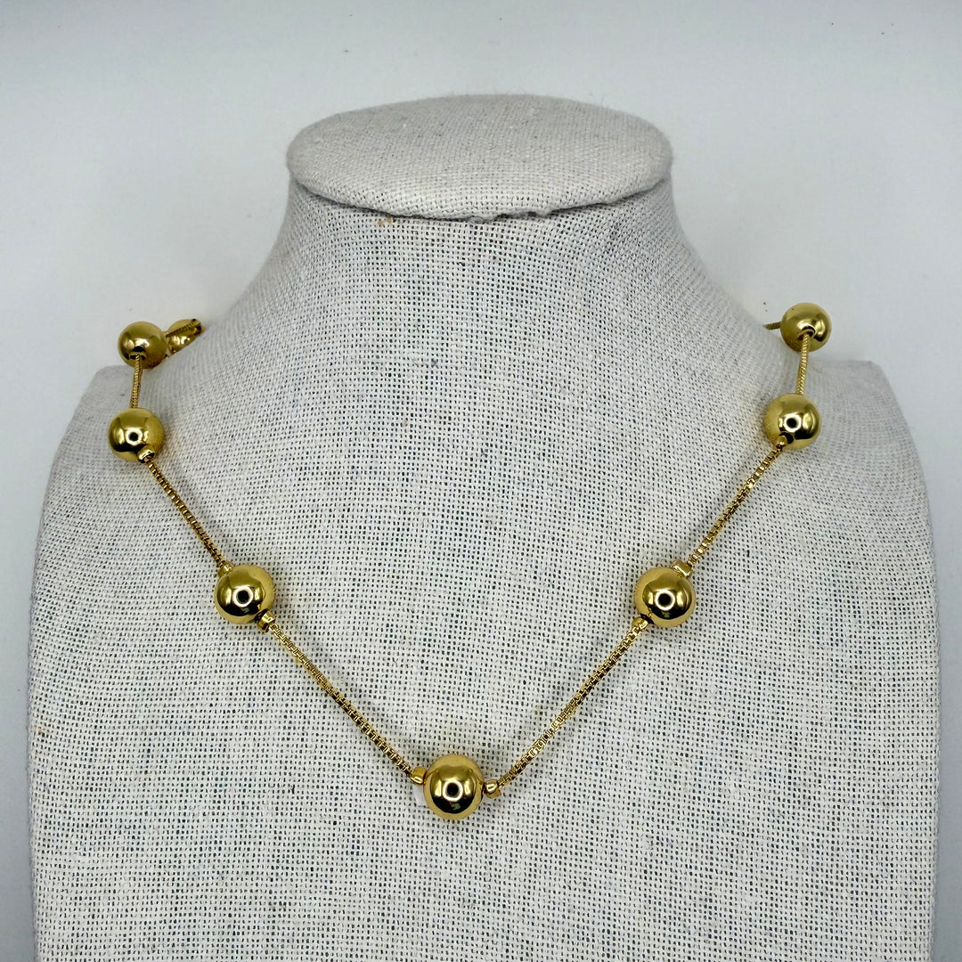 Golden small dots necklace