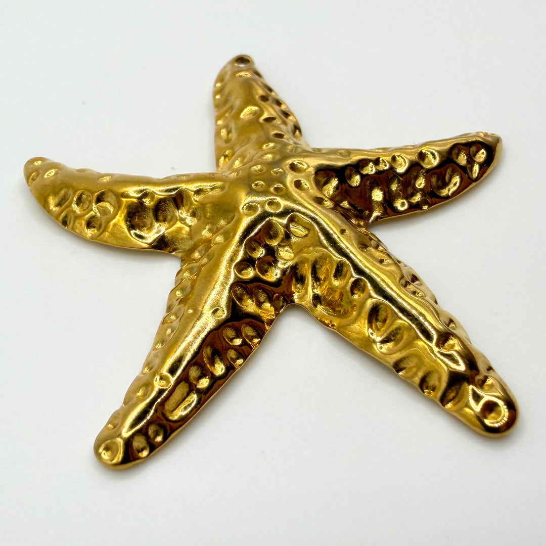 Golden starfish charm